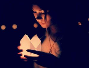 alone girl holding light