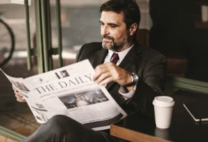 person reading newspaper