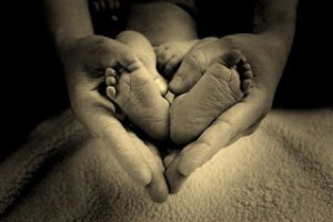 baby feet in mothers hand