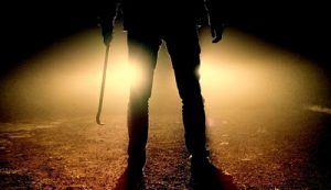 person standing with weapon