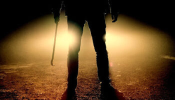 person standing with weapon
