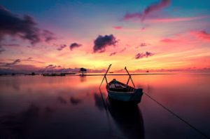 small boat sailing in the sea