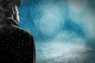 man standing alone in rain